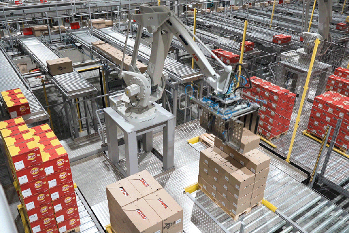 Robot arm moving boxes of PepsiCo product