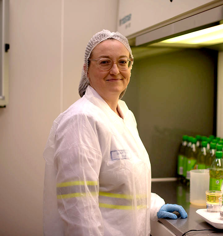 Associate in protective gear working in a lab